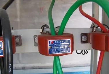 Why should one end of the current transformer be grounded?
